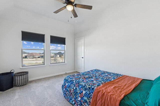 bedroom with baseboards, carpet floors, and ceiling fan
