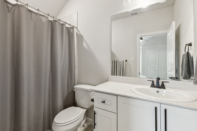 full bathroom with visible vents, toilet, vanity, a shower with curtain, and lofted ceiling