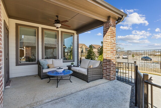 view of patio / terrace with an outdoor living space and a ceiling fan