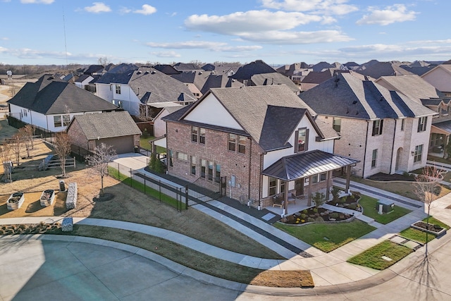 birds eye view of property with a residential view