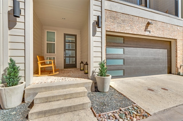 2624 El Camino Ln, Dallas, TX 75212 - doorway to property with concrete driveway and a garage