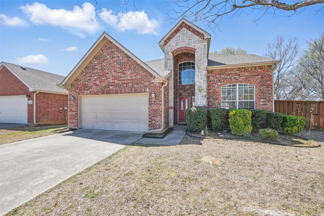 804 Starling Ln, Aubrey, TX 76227 - view of front of house with an attached garage, concrete driveway, brick siding, and a shingled roof