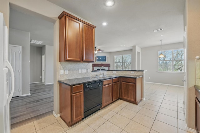 804 Starling Ln, Aubrey, TX 76227 - kitchen featuring black dishwasher, a sink, backsplash, brown cabinetry, and recessed lighting