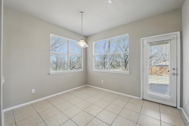 804 Starling Ln, Aubrey, TX 76227 - unfurnished dining area featuring healthy amount of natural light, baseboards, and light tile patterned floors