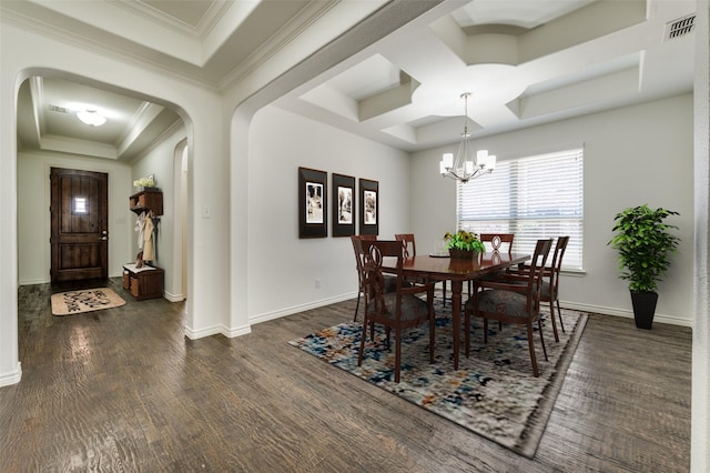 dining space with visible vents, a tray ceiling, dark wood finished floors, arched walkways, and crown molding