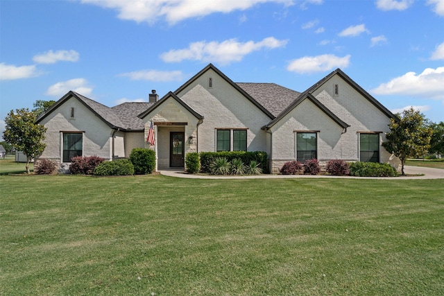 305 Scenic Creek Ct, Reno, TX 76020 - french provincial home with brick siding, a front yard, and a chimney