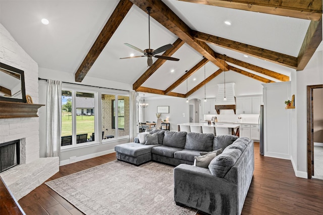 305 Scenic Creek Ct, Reno, TX 76020 - living room with a stone fireplace, ceiling fan, dark wood finished floors, a chandelier, and beam ceiling