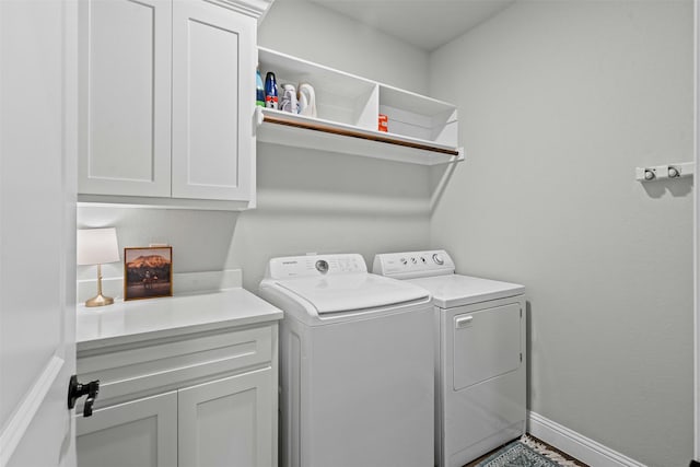 305 Scenic Creek Ct, Reno, TX 76020 - laundry room featuring separate washer and dryer, cabinet space, and baseboards