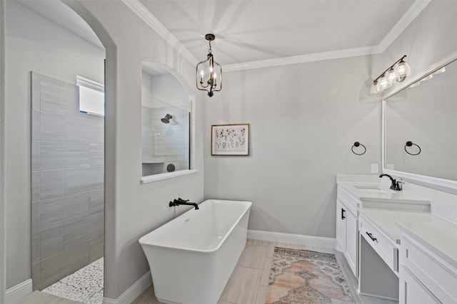 305 Scenic Creek Ct, Reno, TX 76020 - full bathroom featuring a freestanding bath, vanity, a walk in shower, ornamental molding, and a chandelier