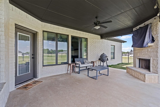 305 Scenic Creek Ct, Reno, TX 76020 - view of patio / terrace featuring an outdoor stone fireplace and ceiling fan