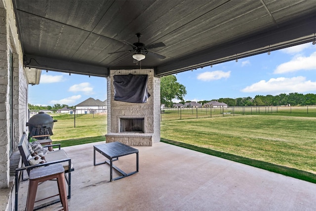 305 Scenic Creek Ct, Reno, TX 76020 - view of patio / terrace featuring an outdoor stone fireplace, a ceiling fan, and grilling area