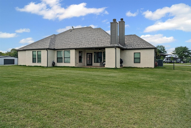 305 Scenic Creek Ct, Reno, TX 76020 - rear view of property featuring a chimney, brick siding, a yard, and roof with shingles