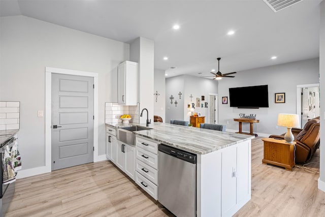 2500 Creek Dr, Granbury, TX 76048 - kitchen featuring dishwasher, a sink, a peninsula, light wood-style flooring, and white cabinetry