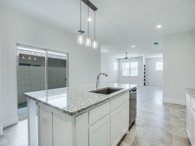 6519 Bowman Roberts Dr, Fort Worth, TX 76179 - kitchen featuring a sink, ceiling fan, decorative light fixtures, white cabinetry, and stainless steel dishwasher