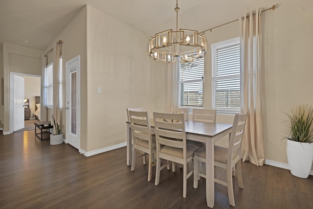 dining space with a notable chandelier, dark wood-style floors, and baseboards
