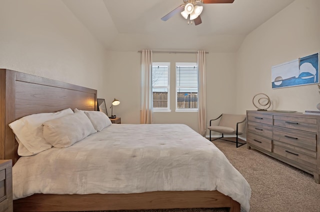 bedroom featuring lofted ceiling, carpet flooring, and ceiling fan
