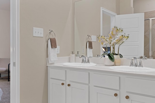 bathroom with double vanity and a sink
