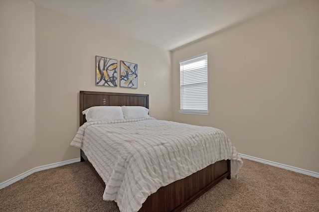 carpeted bedroom with baseboards