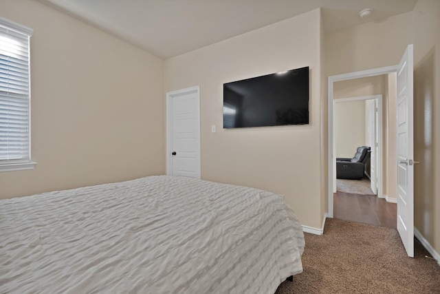 carpeted bedroom with baseboards