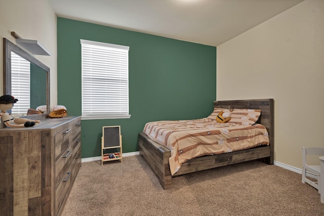 bedroom with carpet flooring and baseboards