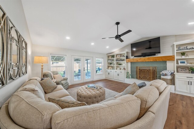 118 Carmel Dr, Bullard, TX 75757 - living area with a fireplace with raised hearth, lofted ceiling, dark wood-type flooring, and a ceiling fan