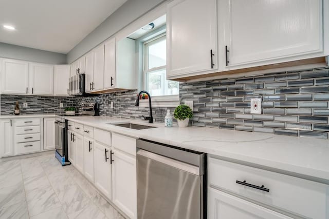 4428 Private Rd Unit 5216, Princeton, TX 75407 - kitchen featuring stainless steel appliances, backsplash, marble finish floor, a sink, and white cabinets