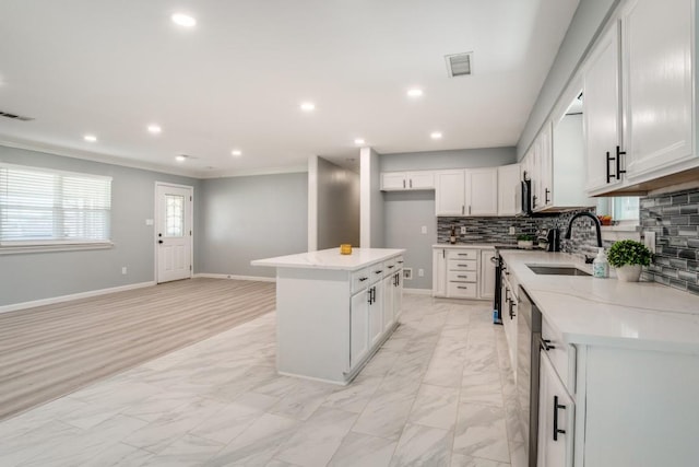 4428 Private Rd Unit 5216, Princeton, TX 75407 - kitchen featuring backsplash, a sink, range, marble finish floor, and visible vents