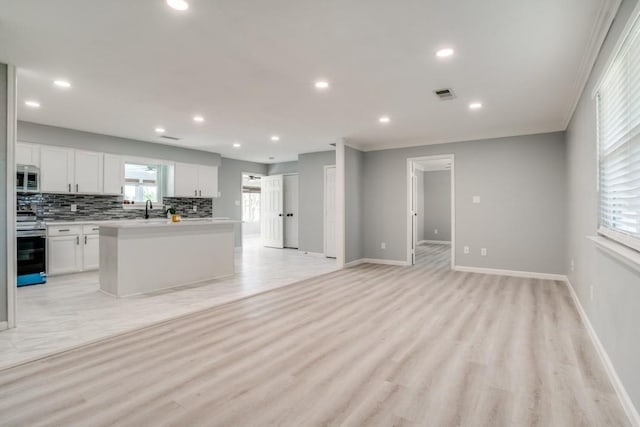 4428 Private Rd Unit 5216, Princeton, TX 75407 - kitchen with light countertops, backsplash, appliances with stainless steel finishes, visible vents, and white cabinets
