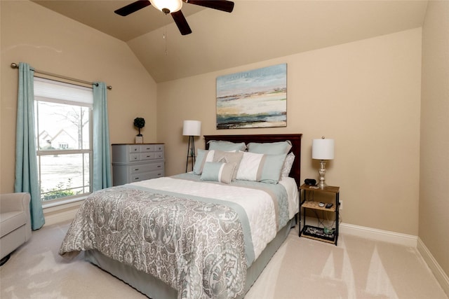 bedroom featuring baseboards, vaulted ceiling, multiple windows, and carpet