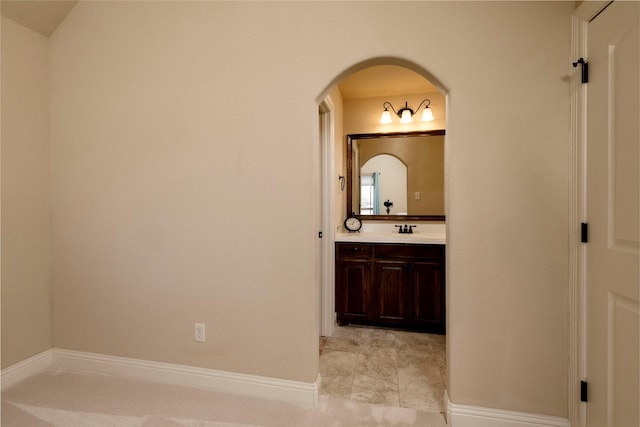 bathroom with baseboards and vanity