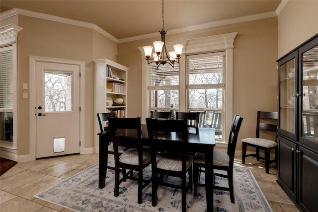 dining area with crown molding, baseboards, a chandelier, and light tile patterned floors