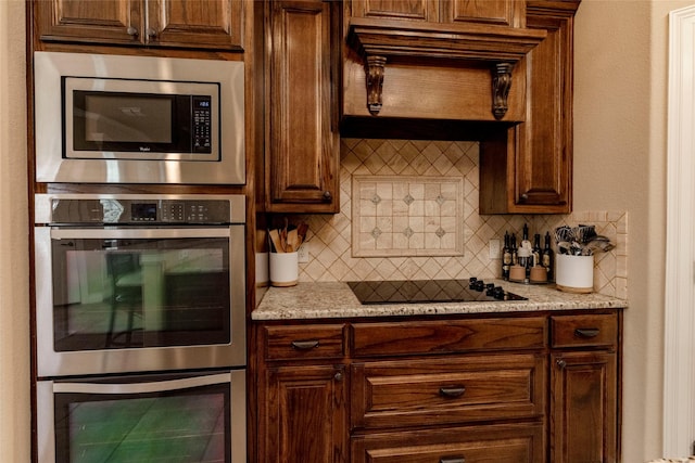kitchen featuring decorative backsplash and stainless steel appliances