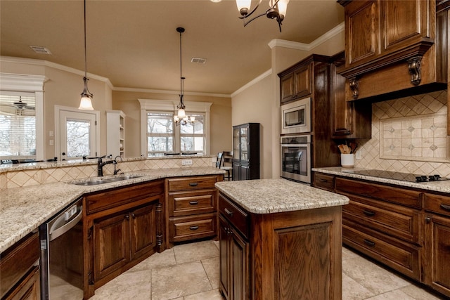 kitchen featuring decorative backsplash, visible vents, appliances with stainless steel finishes, a sink, and a chandelier