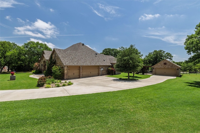 view of home's exterior with driveway, a lawn, a detached garage, a shingled roof, and stone siding