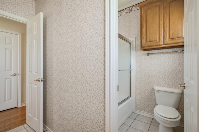 4288 Fm 1652, Grand Saline, TX 75140 - full bathroom featuring baseboards, wallpapered walls, tile patterned floors, toilet, and combined bath / shower with glass door