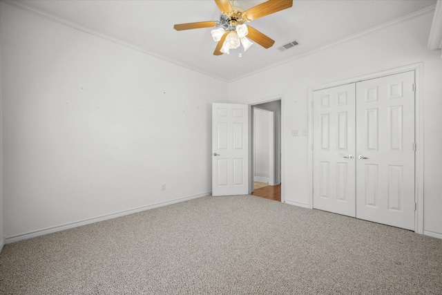 4288 Fm 1652, Grand Saline, TX 75140 - unfurnished bedroom with visible vents, ornamental molding, a closet, carpet flooring, and baseboards