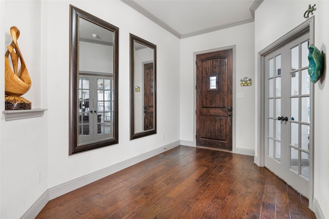 foyer featuring crown molding, dark wood-style flooring, baseboards, and french doors