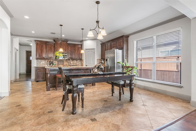 dining room featuring visible vents, arched walkways, baseboards, ornamental molding, and recessed lighting