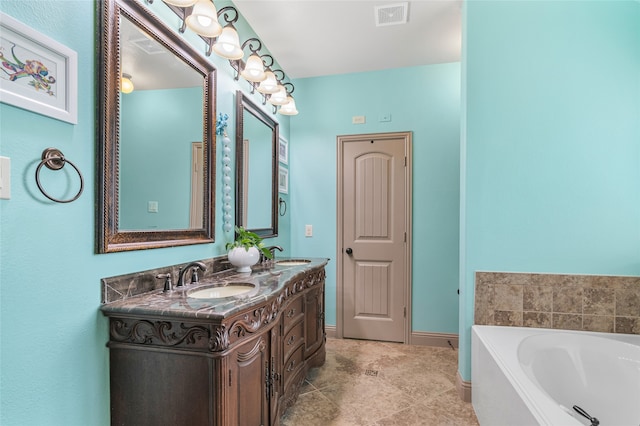 full bath featuring a sink, double vanity, a bath, and visible vents