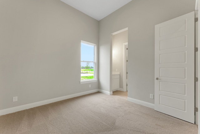 9828 Palermo Ln, Mesquite, TX 75126 - spare room featuring baseboards and light carpet