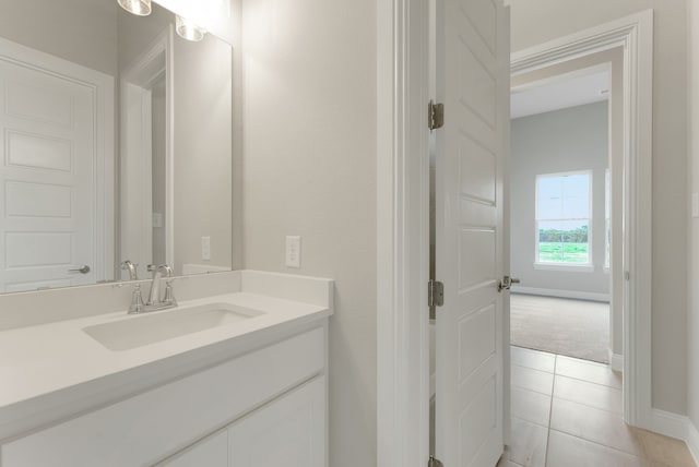 9828 Palermo Ln, Mesquite, TX 75126 - bathroom featuring vanity, baseboards, and tile patterned flooring