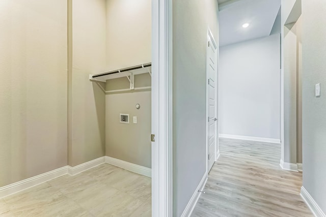 9828 Palermo Ln, Mesquite, TX 75126 - washroom with gas dryer hookup, laundry area, baseboards, light wood finished floors, and hookup for a washing machine