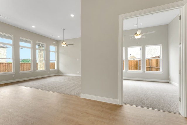 9828 Palermo Ln, Mesquite, TX 75126 - spare room featuring baseboards, a ceiling fan, and a healthy amount of sunlight