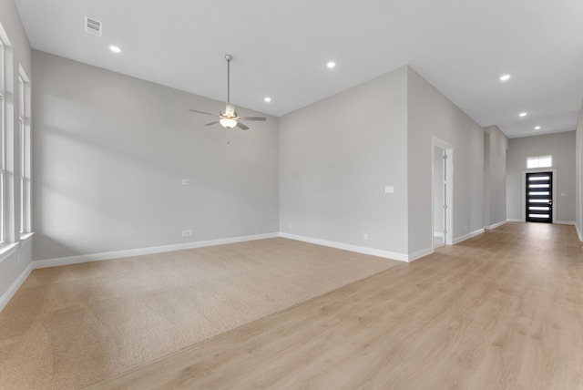 9828 Palermo Ln, Mesquite, TX 75126 - spare room featuring visible vents, a ceiling fan, light wood-style flooring, and baseboards