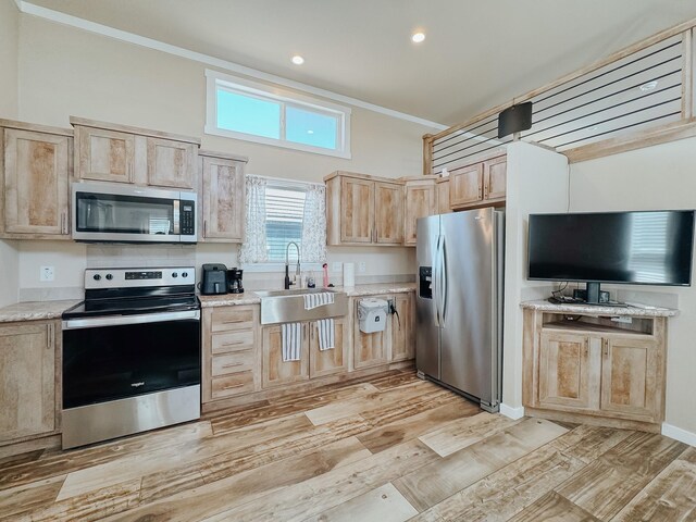 6400 Peninsula Rd, Kerens, TX 75144 - kitchen featuring light brown cabinets, a sink, light wood-style floors, appliances with stainless steel finishes, and crown molding