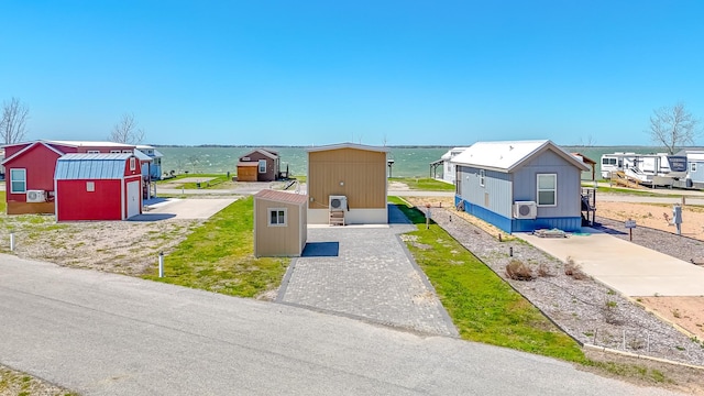 6400 Peninsula Rd, Kerens, TX 75144 - view of front of house with an outbuilding and a shed
