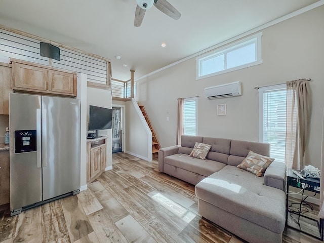 6400 Peninsula Rd, Kerens, TX 75144 - living room featuring light wood finished floors, baseboards, a wall unit AC, a high ceiling, and a ceiling fan