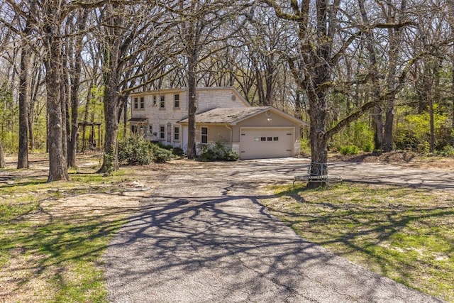 view of front of home featuring a garage and driveway