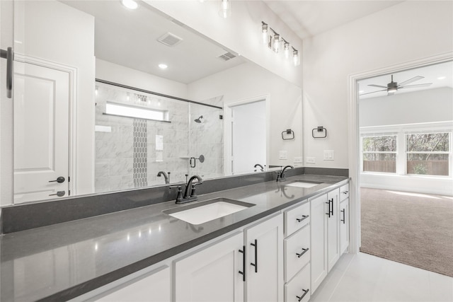 216 Dove Haven Dr, Wylie, TX 75098 - full bathroom with double vanity, a tile shower, ceiling fan, and recessed lighting