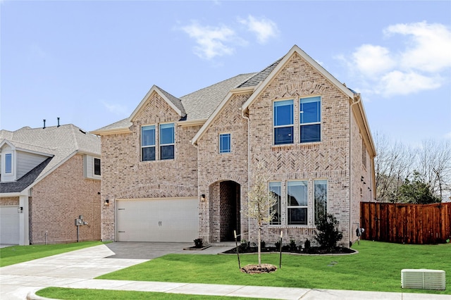 216 Dove Haven Dr, Wylie, TX 75098 - traditional-style house featuring concrete driveway, an attached garage, and brick siding
